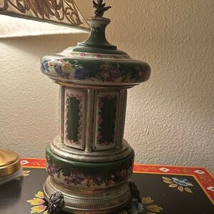 Reuge lipstick cigarette carousel: Green Floral hand painted with cherub on top.